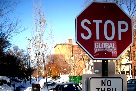 A vandalized global warming sign - Commons 